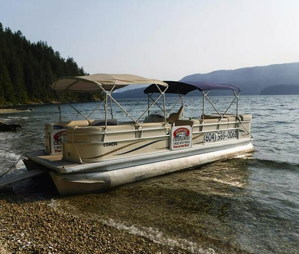 pontoon boat beached in Sechelt Inlet