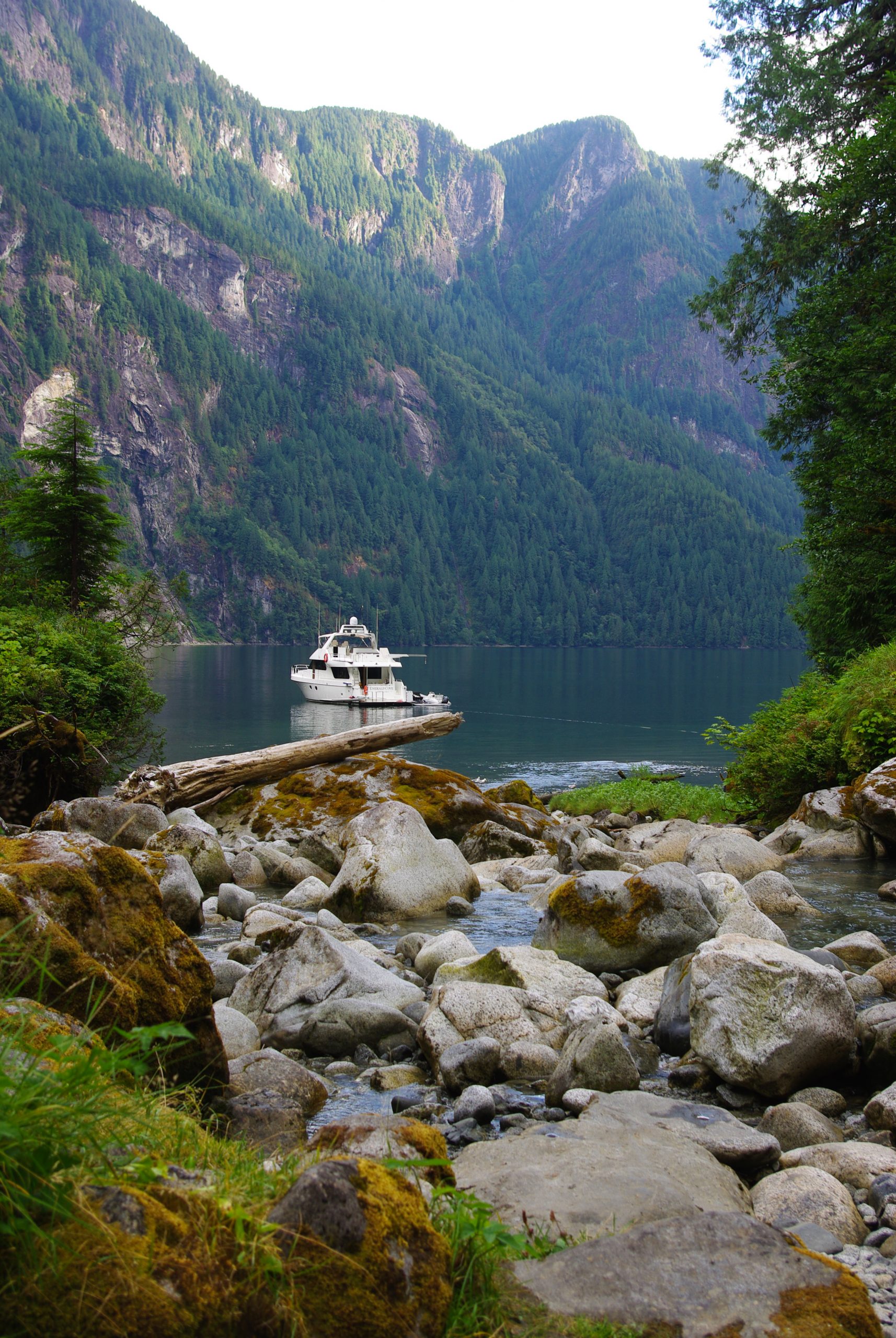 A boat anchored in front of Chatterbox Falls in Princess Louisa Inlet.